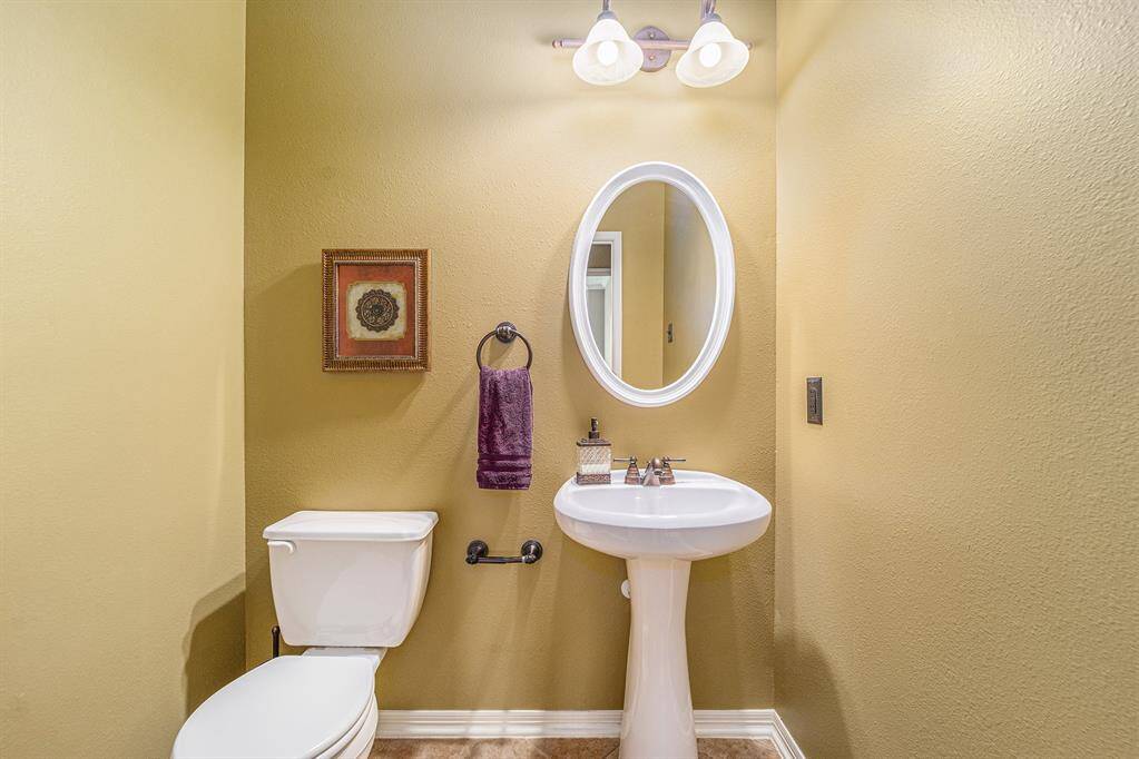 A quaint powder room is available for guests to freshen up during their visit!