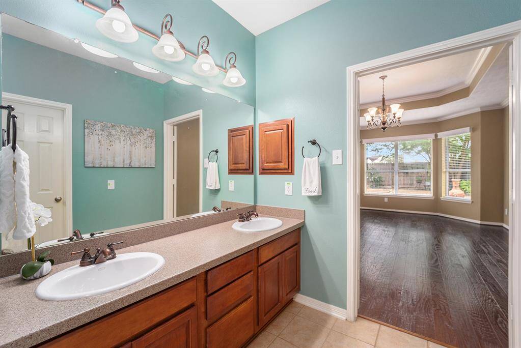 A large mirror and lighting are ideal for those morning of getting it together before heading out the door!