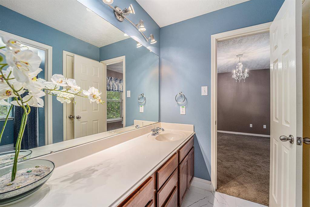 Another view of the large vanity with ample storage in the jack-n-jill bathroom!