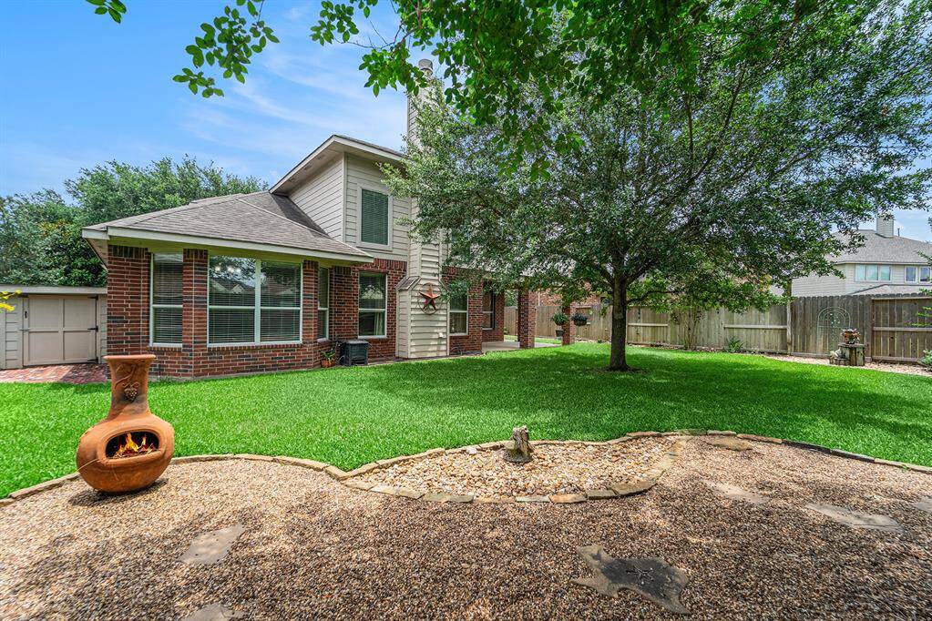 A storage shed with electricity, just to the left of the home, provides extra storage for garden tools, lawn equipment or yard games like horseshoes or lawn darts!