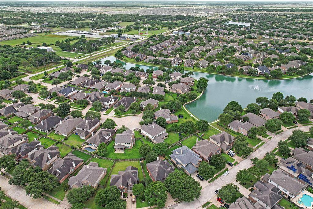 An aerial view of this wonderful, gated community!  This home is located in a section that has extra pool access for those dog days of living in Texas!  The community also offers a splash pad, fitness center and a quick walk to the area lakes!