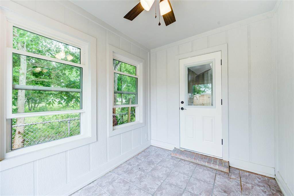 Enclosed patio area off the kitchen. Perfect for your morning coffee.
