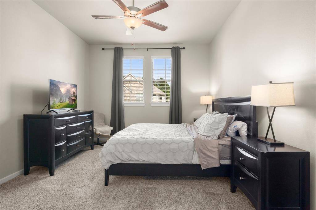 Primary bedroom is spacious and tucked away from the living area.
