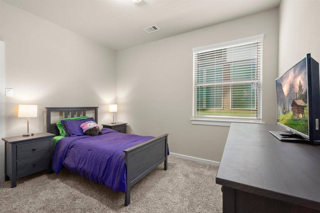 One of two secondary bedrooms.