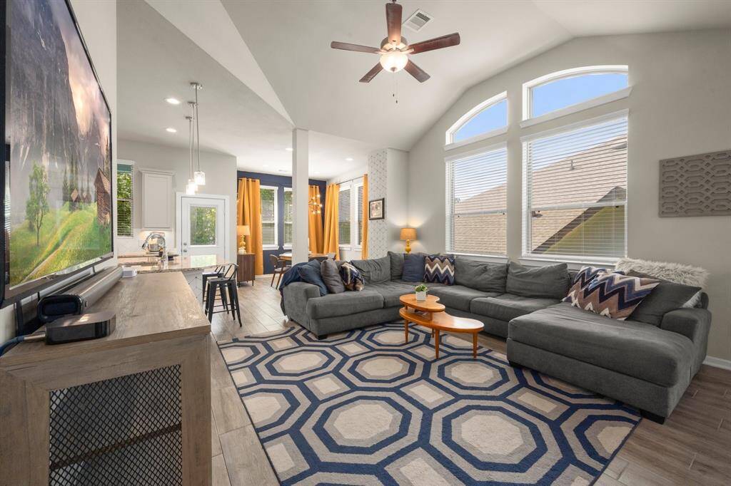 Main living area is spacious with soaring ceilings and large windows!