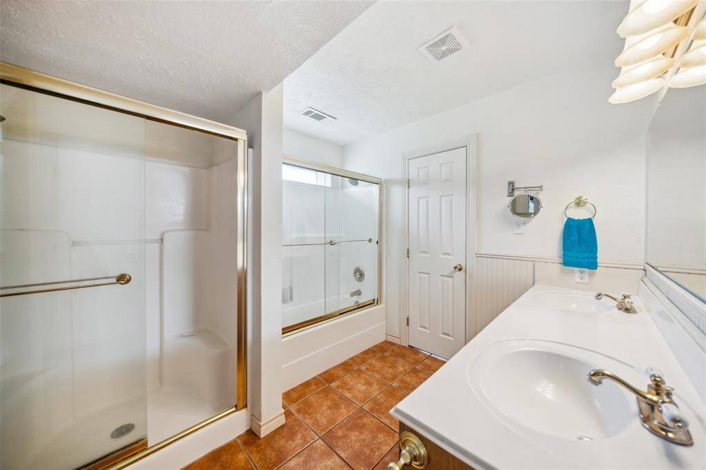 Bathroom with shower/tub combo and 2nd separate shower