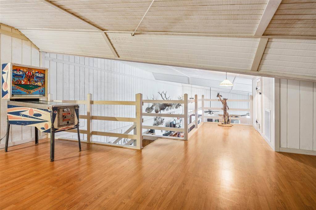 Upstairs loft has attic access to mechanicals and tons of storage.