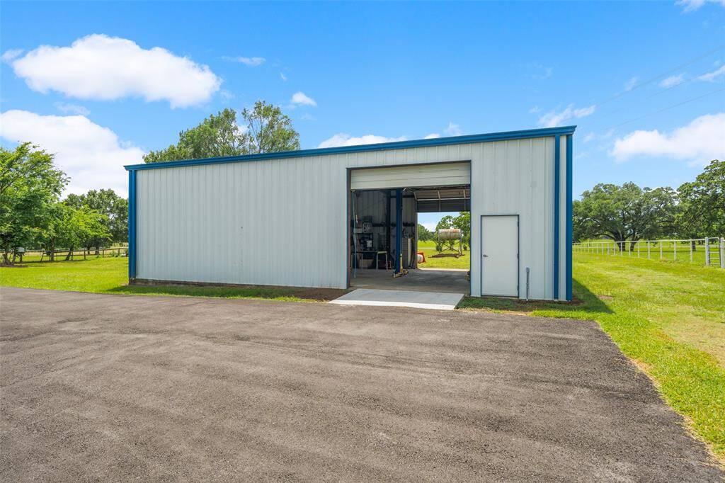 30'x50' Building #1 with auto lift installed and has built-in shelving