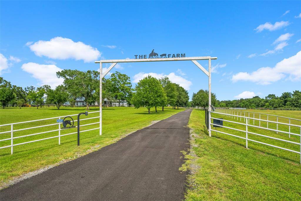 Gated entrance to the property with new asphalt driveway