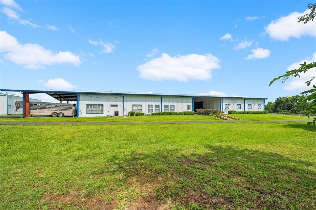 Barndominium with living quarters, pool, apartment, stalls, storage and so much more!