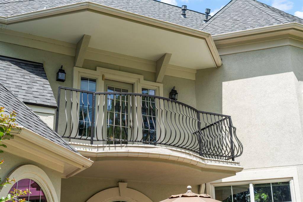 The balcony overlooks the backyard and golf course.
