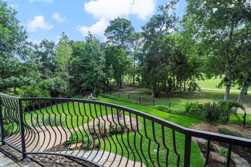 The balcony overlooks the backyard and golf course.