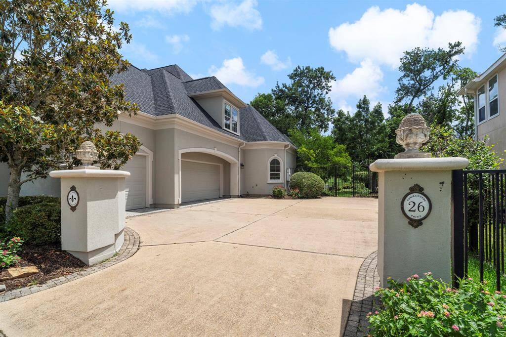 The driveway has plenty of parking space leading to the three car oversized garage.