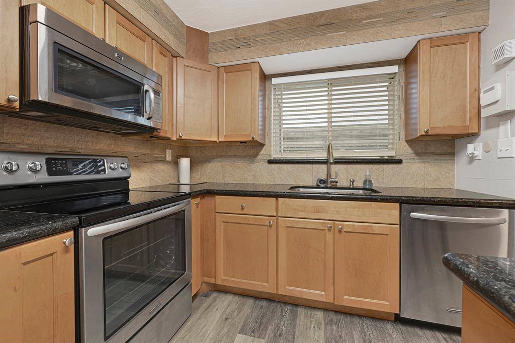 Granite countertops & upgraded stainless steel appliances.