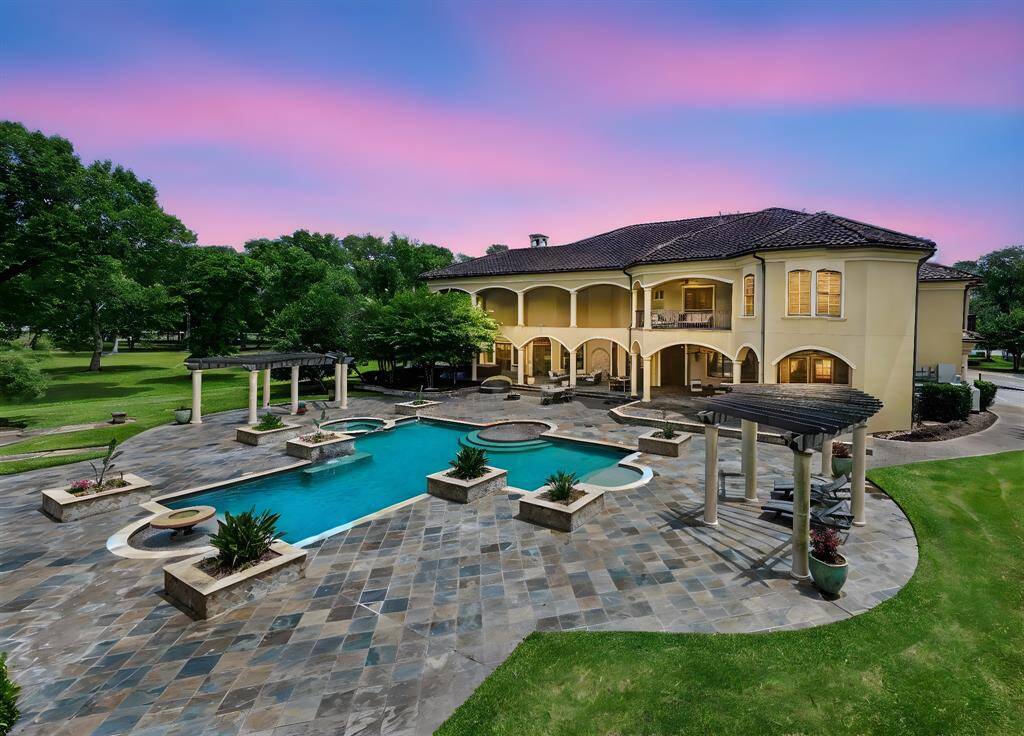 Step into the backyard oasis, with alarge covered patio and relaxing pool creating aninviting outdoor retreat.