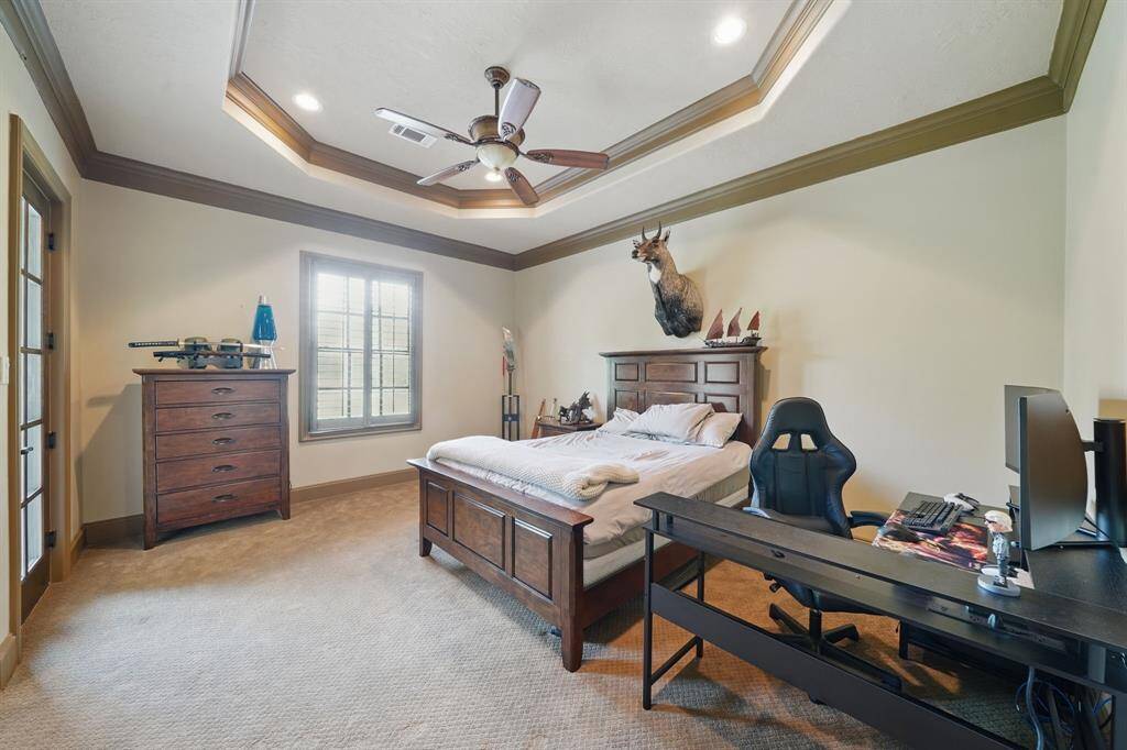 Third bedroom features high ceilings with recessed lighting, large windows, and plush carpet.