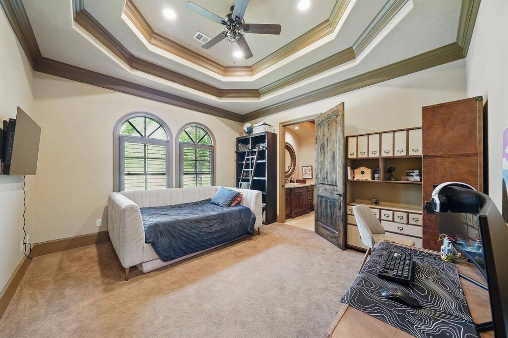 Fourth bedroom features high ceilings with recessed lighting, large arched windows, en-suite bathroom, and plush carpet.