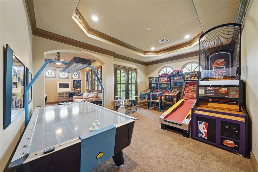 The guest house has plush carpet, high ceilings, large windows, and plenty of space.