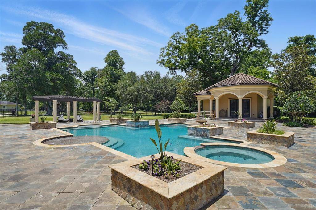 Large trees throughout the property provide additional privacy.