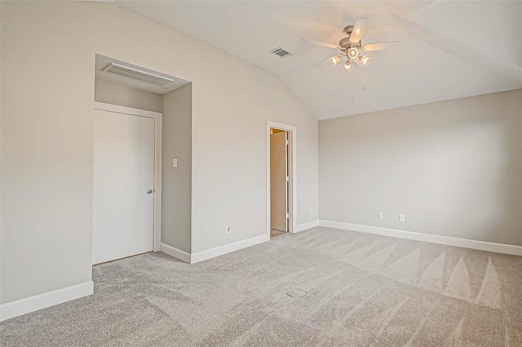 Another view of the primary bedroom