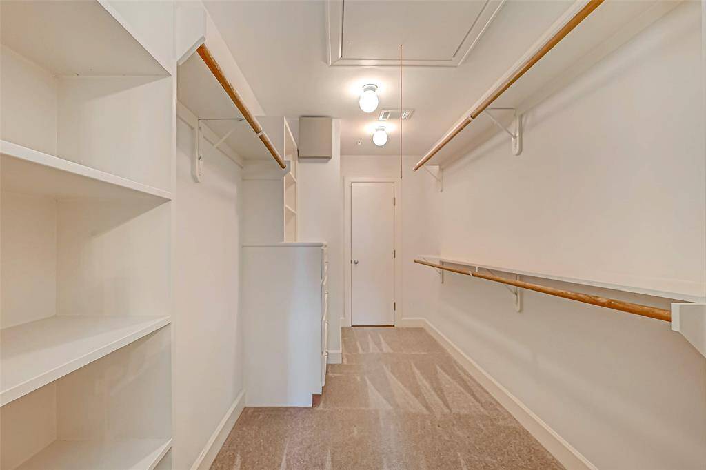 Large walk in closet with built ins