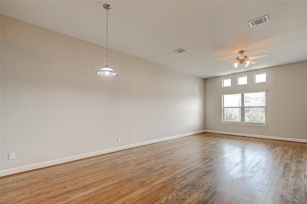 Another view of the living room with lots of windows