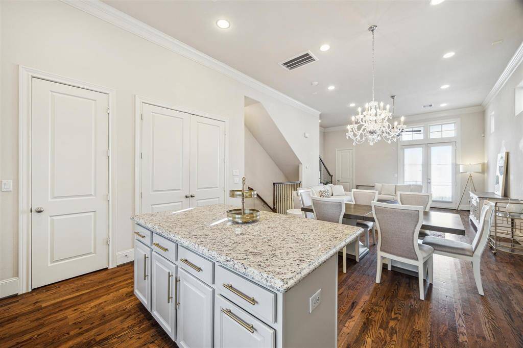Large walk in pantry to the left of the kitchen island and the utility closet.