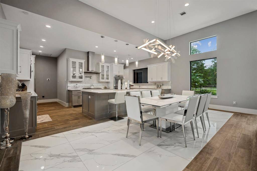 Premium appliances, a stunning center island, and dual sinks make meal preparation both effortless and enjoyable.