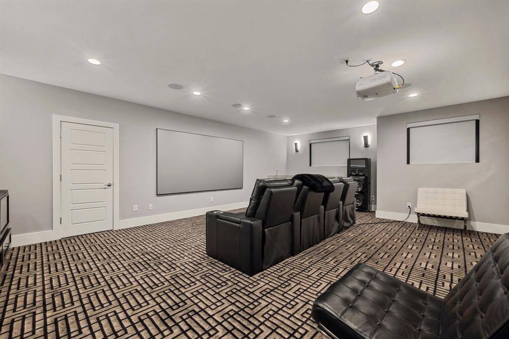 A spacious media room designed for ultimate entertainment, offering the perfect space for movies, gaming, and relaxation.
