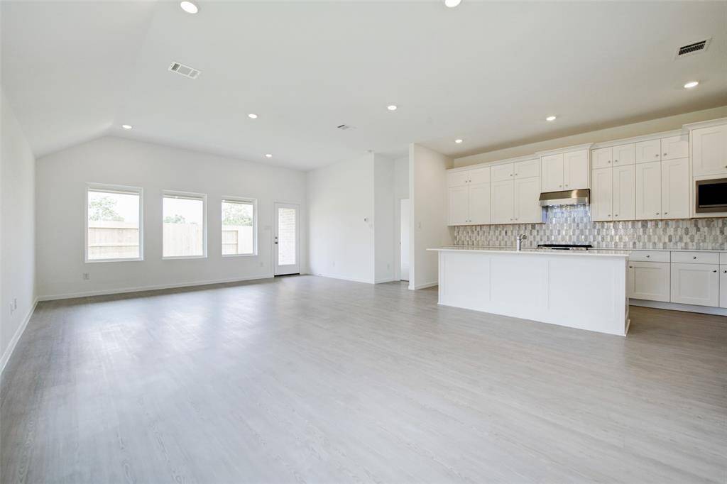 Sleek recessed lighting adds a contemporary touch throughout