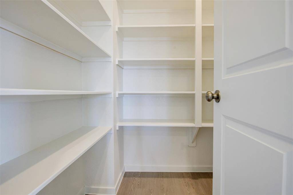 Walk-in pantry with built-in shelving