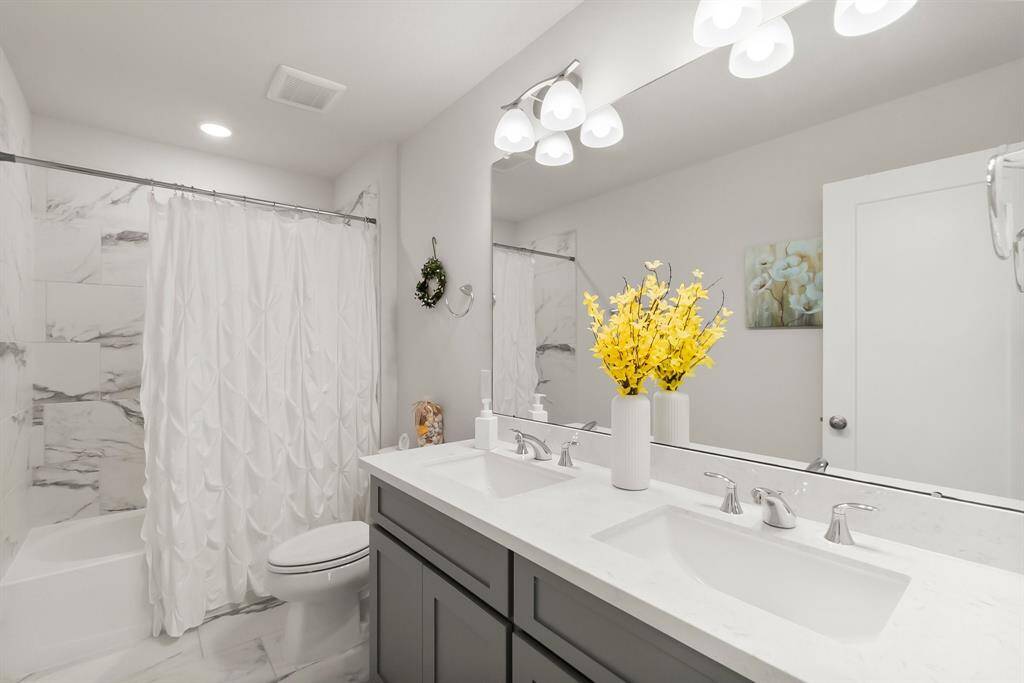 Upstairs bathroom offers two sinks!