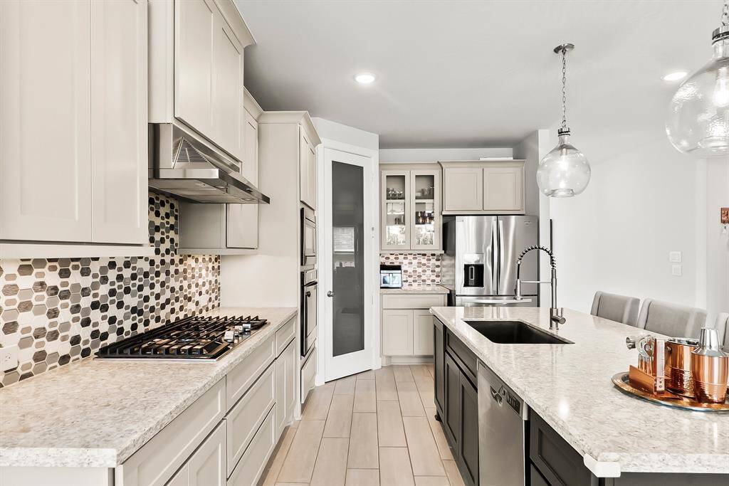 Quartz countertops and a designer backsplash