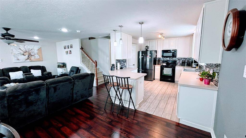 This open-concept living area features a cozy lounge.