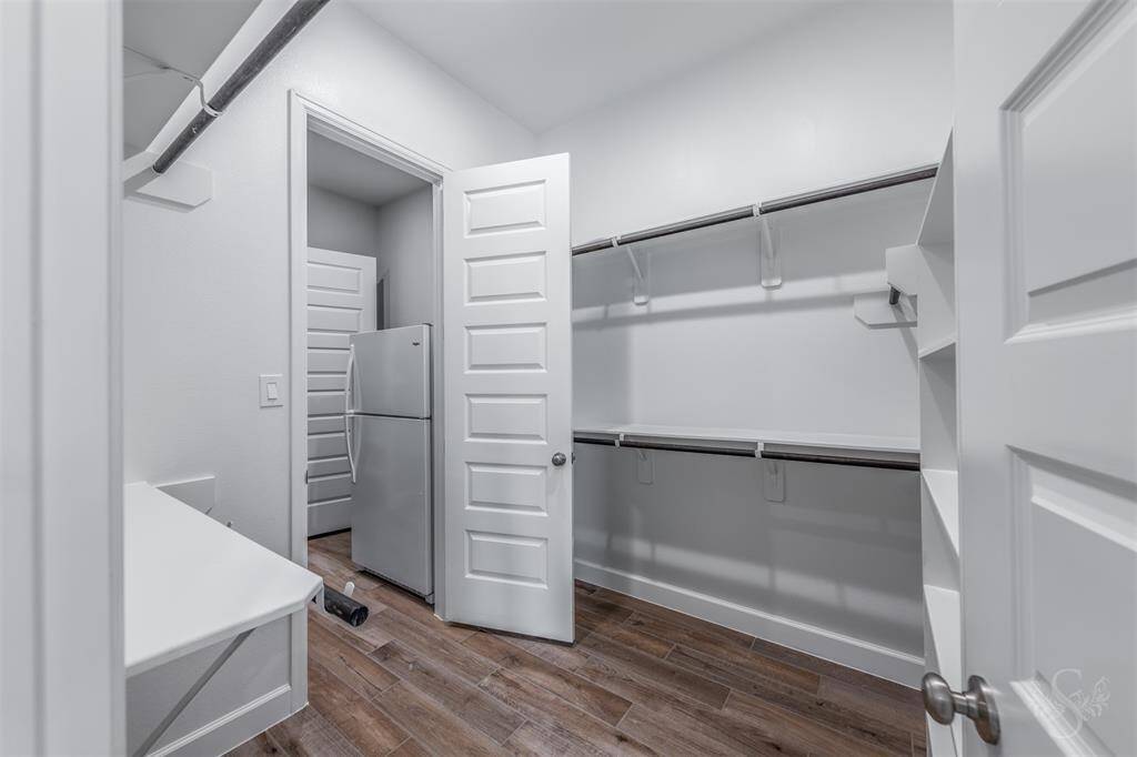 2nd bedroom closet in the primary bedroom with pass through access to the laundry room.