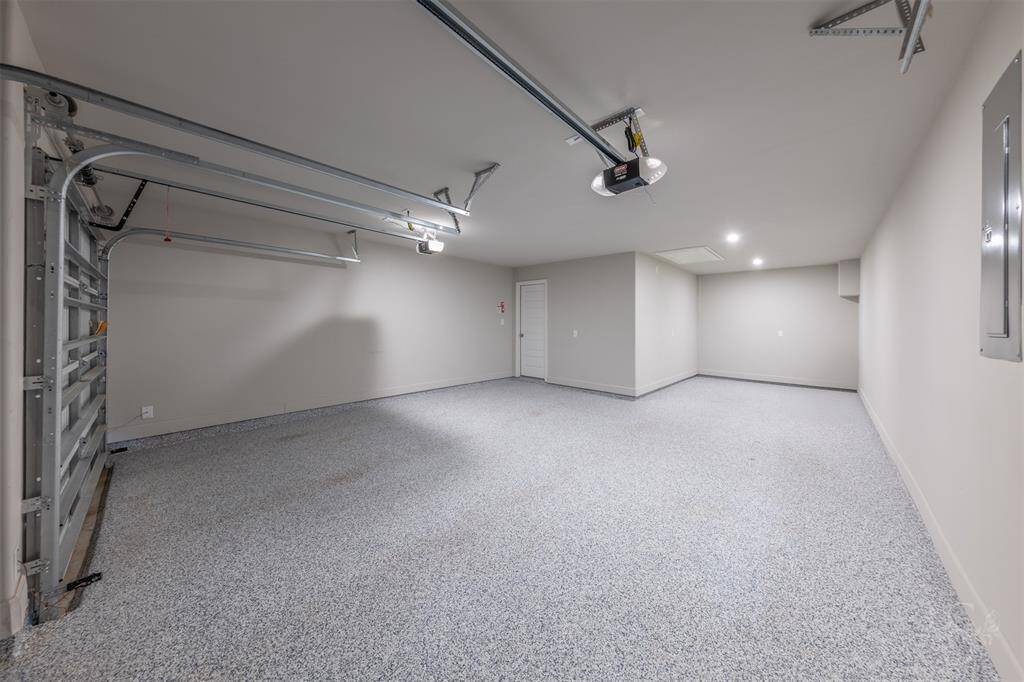 3 car garage with epoxy coated floors.