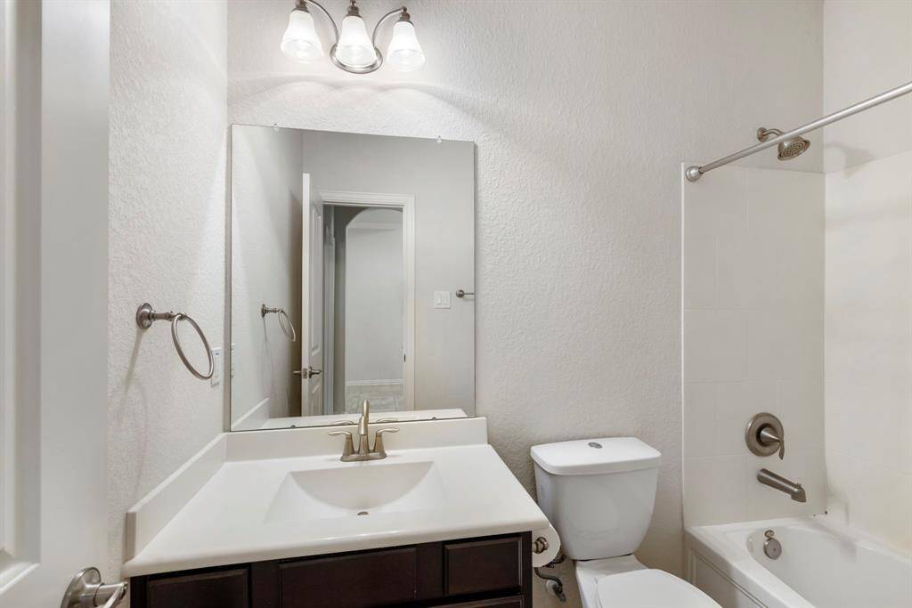 A full bath with shower/tub combination as well as hallway access.