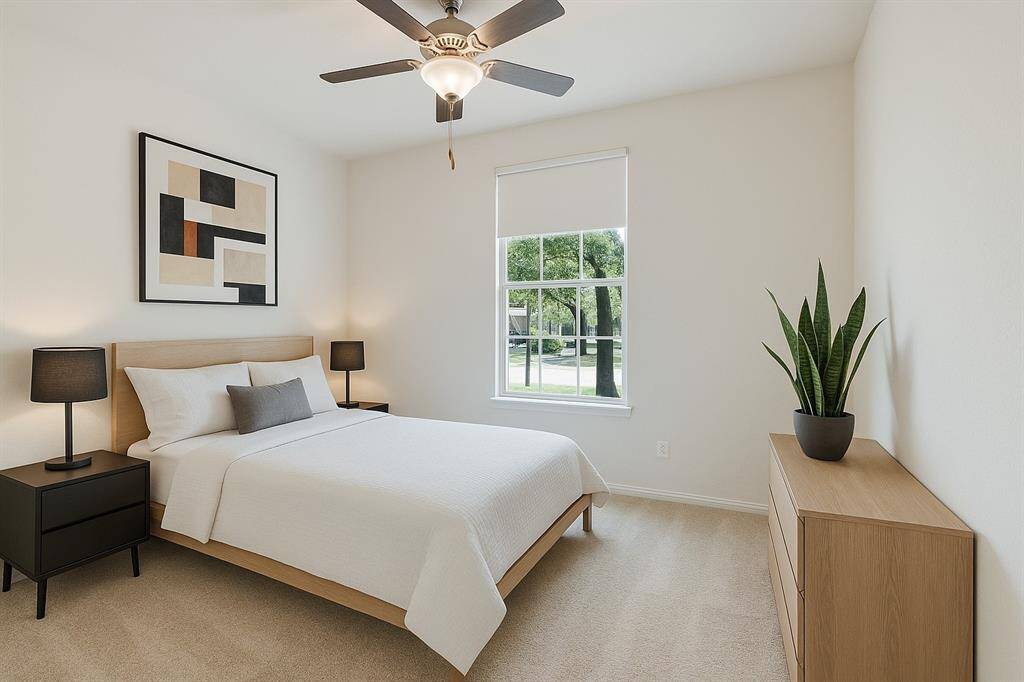 Secondary bedroom #2 is located in the front of the home with generously sized closed and new carpet. *This image has been virtually staged.
