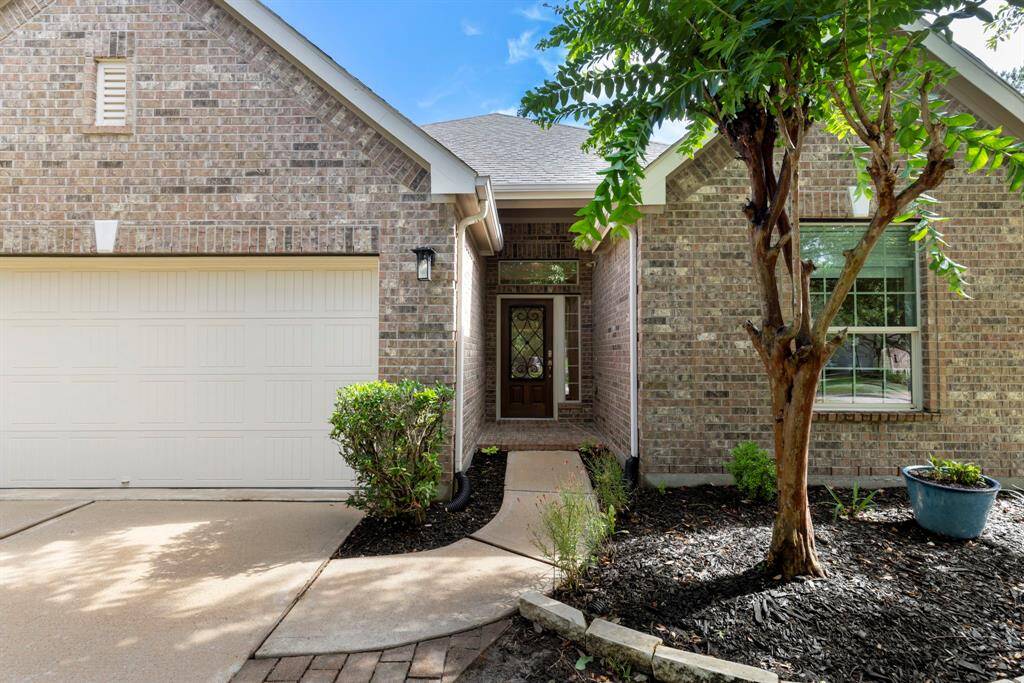 Inviting entry and oversized two-car garage with extra workshop space!
