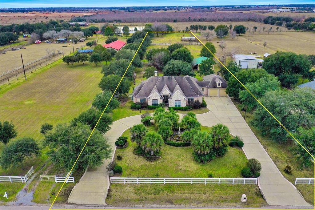 Three-acre property featuring two cross-fenced pastures. New roof installed since photos.