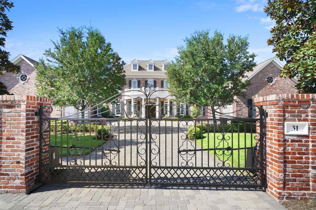 Welcome to 31 Southern Crescent Court! Gates open to a home with majestic curb appeal. Automatic double iron gates, side gate, and fencing are a replica of the gates at Mompesson House in Salisbury, England and the Cabell House in Richmond, VA built in 1924 by William Lawrence Bottomley. Traditional Georgian architecture originated in the 1700's and is timeless and enduring and not subject to fleeting trends.