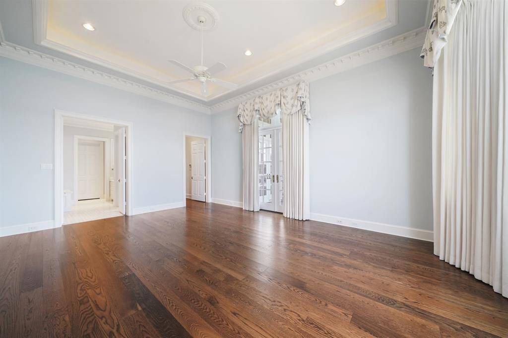 Another view of the Owner's Retreat. Extensive White River multi-profile crown molding with dentil trim and cove lighted 13' high ceiling. Custom curtains inspired by designer Henrietta Spencer-Churchill "Georgian Style and Design".