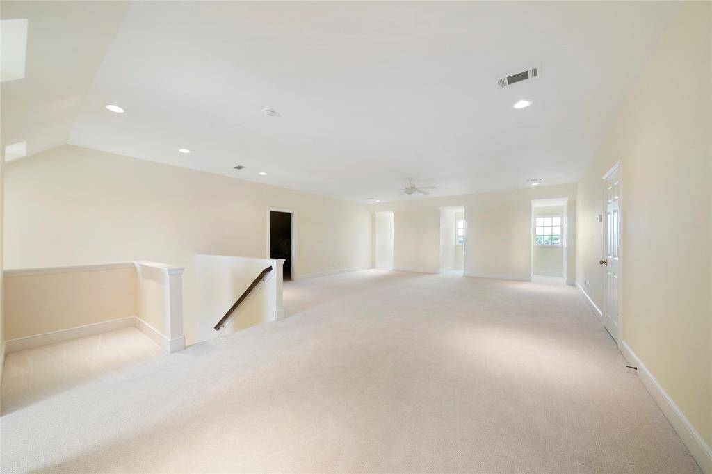 Generously sized third floor flex/bedroom/game room with flanking 2 rooms with AC storage space. Third floor has incredible panoramic views of the East Shore skyline on the right side dormers and stunning panoramic lake views on the left side dormers. Seller has floorplans to convert this room into additional 2 bedrooms and 2 bathrooms with a game room/loft.