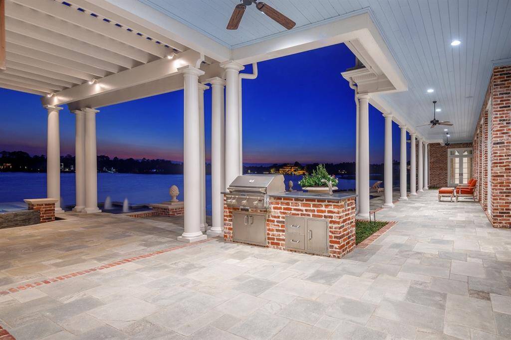 This home is strategically positioned to catch the lake breezes through the patio and the exact placement of the home on the lot was revised several times during the planning stages to reflect this. 12-ft-deep covered patio. 1906 sq ft covered patio, balcony, and porch. Haint blue shiplap ceiling. Mosquito mist and generator.