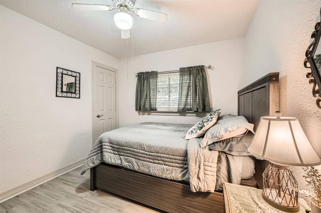 3106 Village Spring Ct. This secondary Cozy bedroom featuring a ceiling fan, neutral tones, , offering a warm and inviting atmosphere.