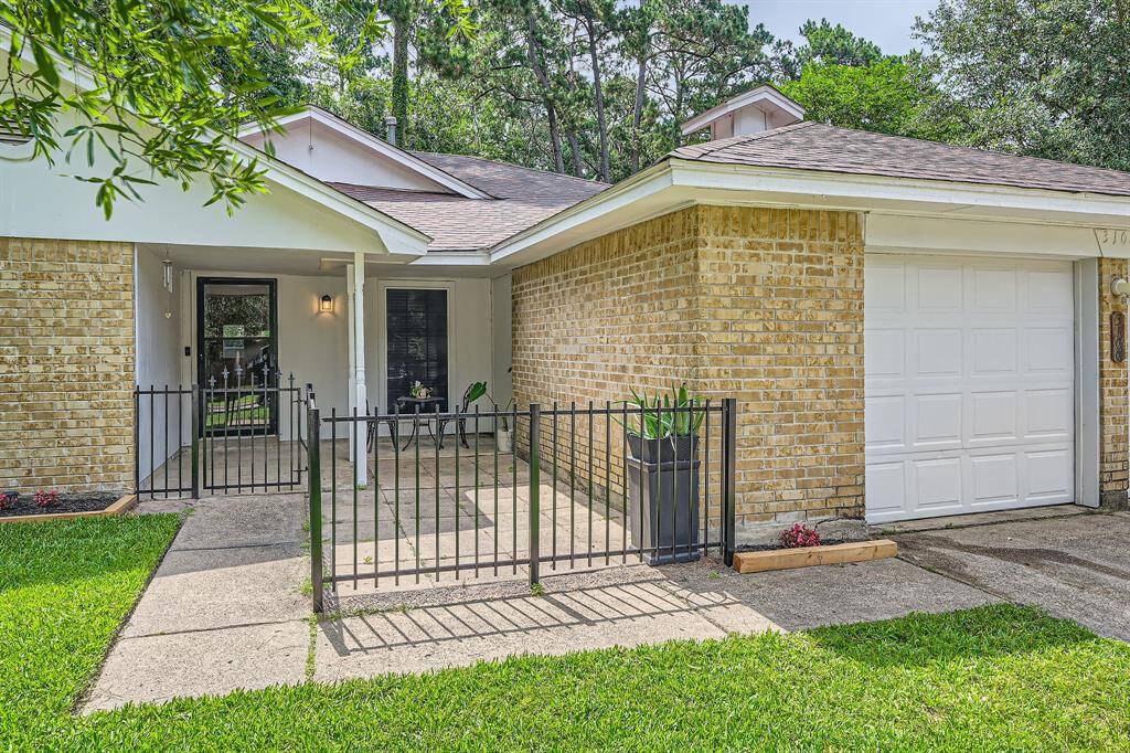 3106 Village Springs CT. Charming single-story home with a brick exterior, welcoming front porch, and a neatly fenced entry. The attached garage and manicured lawn add to its curb appeal. Perfect for comfortable living.
