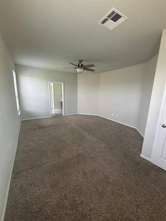 Just off the living room is this ample primary bedroom