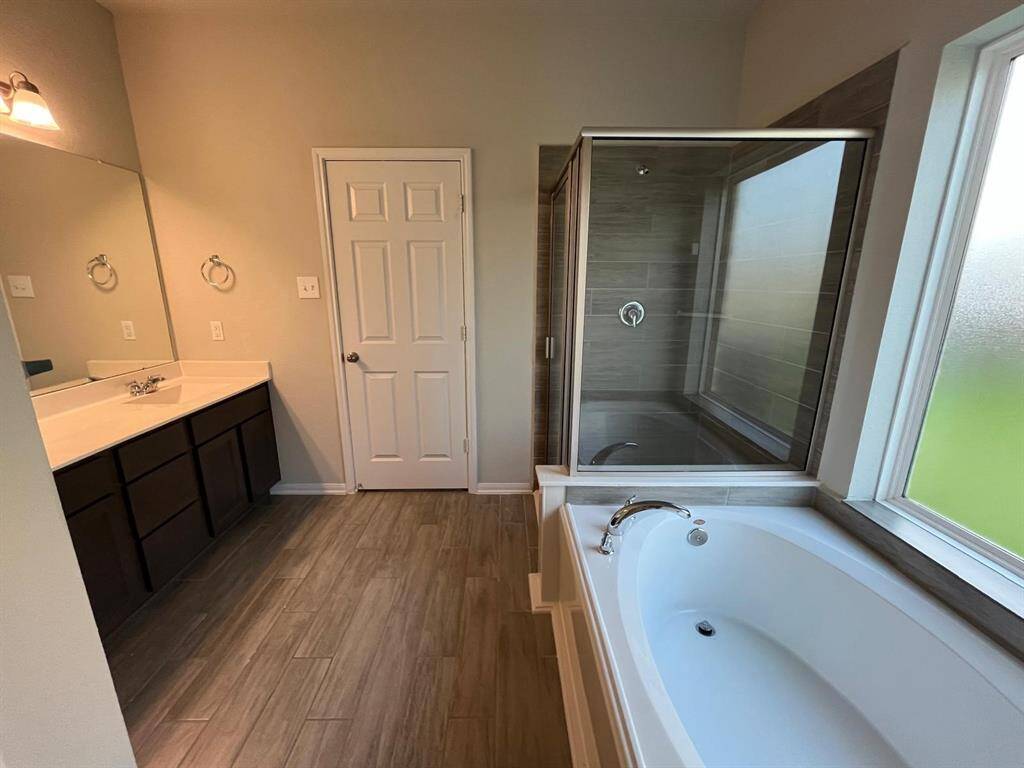Great primary bathroom with separate shower