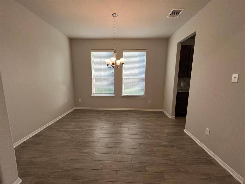 Just past the study you will find this tiled dinning room, perfect for gatherings!