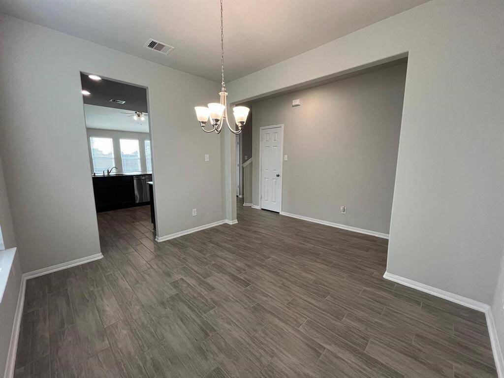 Another angle of the dinning room, looking into the kitchen